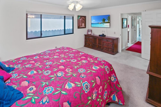 bedroom with ceiling fan, ornamental molding, and light carpet