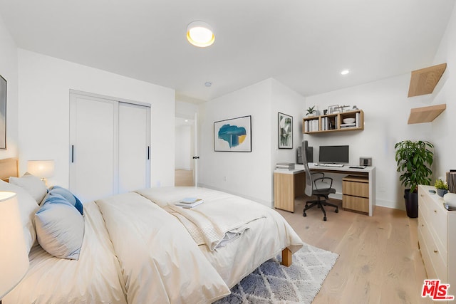 bedroom featuring a closet and light hardwood / wood-style flooring