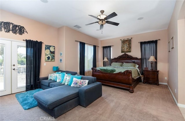 bedroom featuring french doors, access to outside, ceiling fan, and light colored carpet