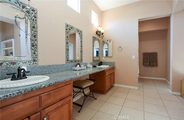 bathroom with tile patterned flooring and vanity