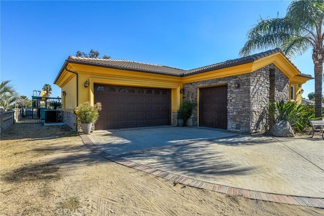 view of side of home with a garage