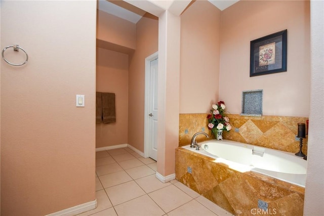 bathroom with tile patterned floors and a relaxing tiled tub