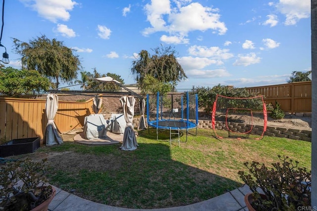 view of yard featuring a trampoline