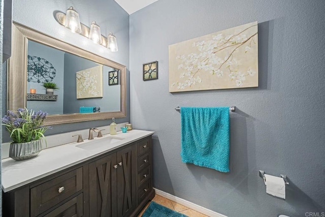 bathroom with tile patterned floors and vanity