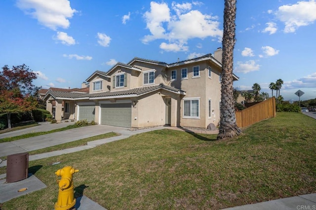 view of front facade with a garage and a front lawn