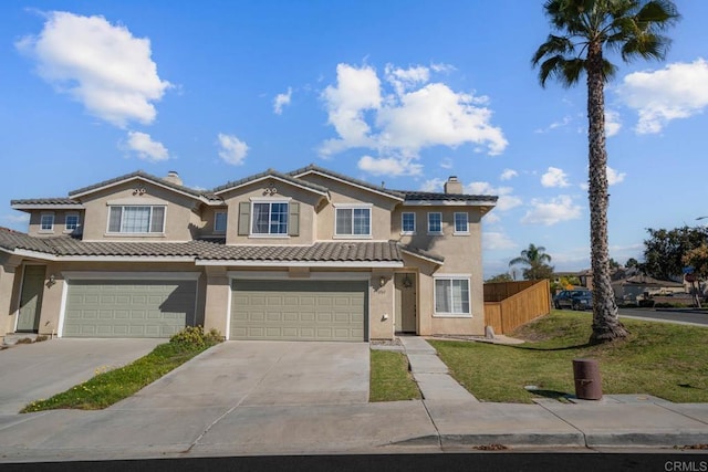 view of front facade with a garage and a front yard