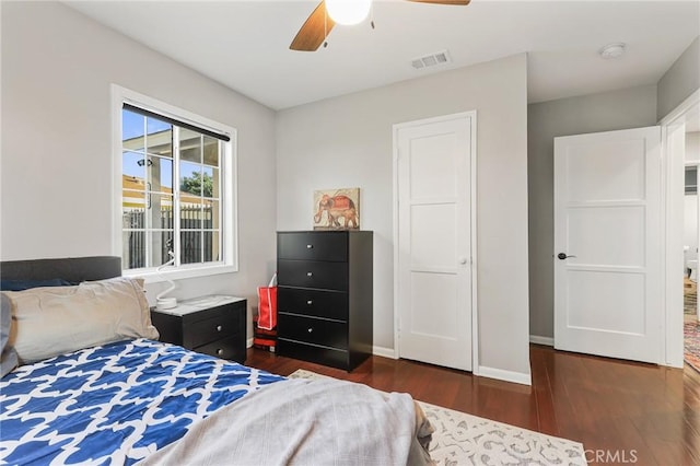 bedroom featuring ceiling fan and dark hardwood / wood-style flooring