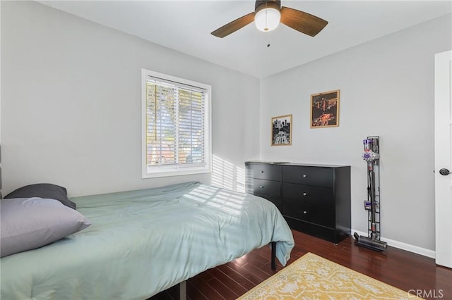 bedroom featuring ceiling fan and dark hardwood / wood-style flooring