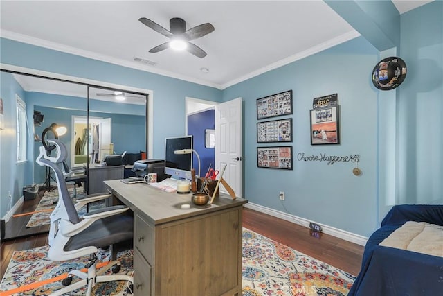 office area featuring ceiling fan, dark wood-type flooring, and crown molding