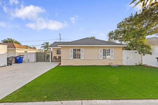 rear view of house with a lawn