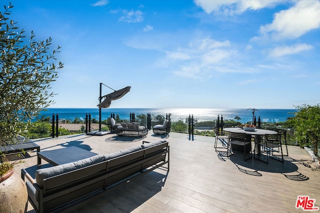 exterior space with a water view and an outdoor hangout area