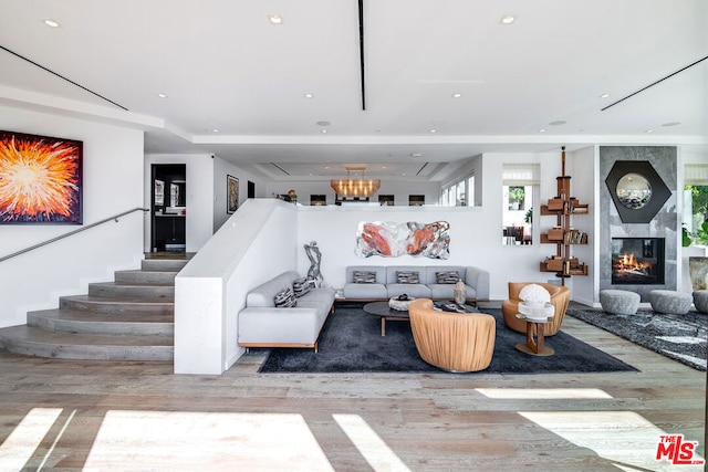 living room featuring a fireplace and light wood-type flooring