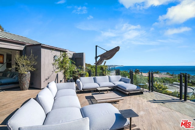 view of patio / terrace featuring a deck with water view and an outdoor hangout area