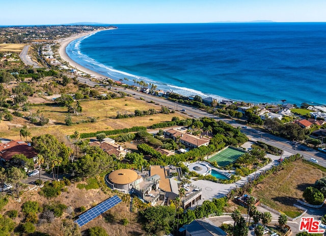 birds eye view of property featuring a view of the beach and a water view