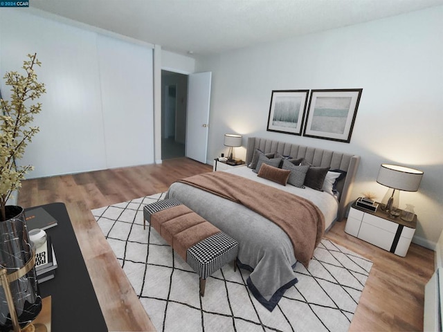 bedroom with light wood-type flooring