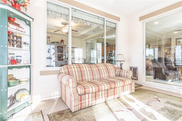 sunroom / solarium featuring ceiling fan