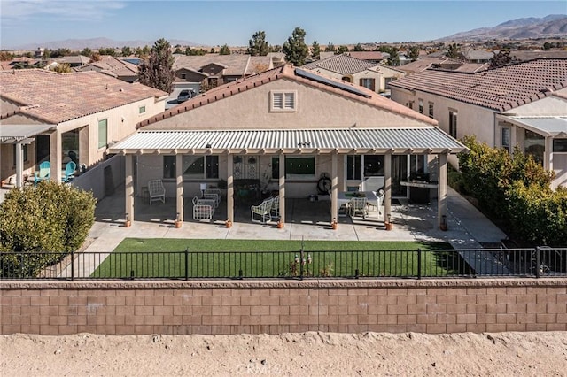 back of property featuring a mountain view