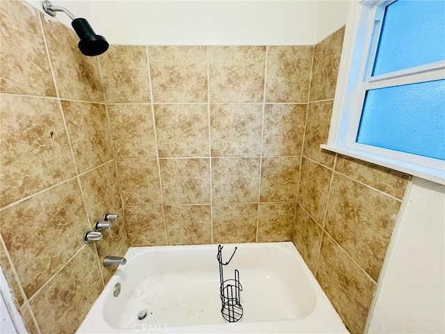 bathroom featuring  shower combination