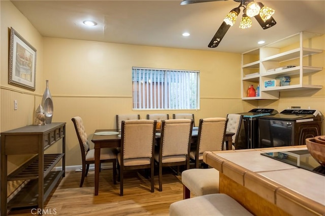 dining room with light hardwood / wood-style floors and ceiling fan