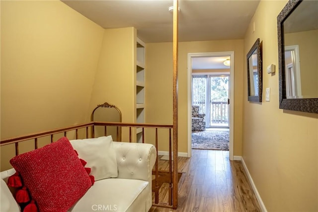 hallway with wood-type flooring