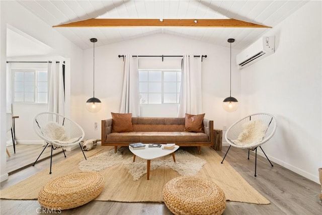 sitting room with hardwood / wood-style floors, vaulted ceiling with beams, wood ceiling, and a wall mounted AC