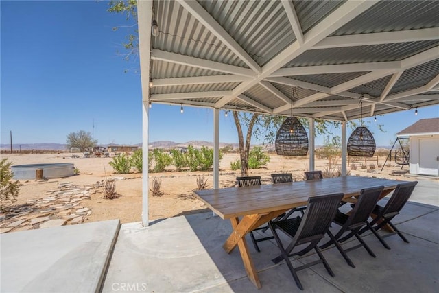 view of patio / terrace with a mountain view