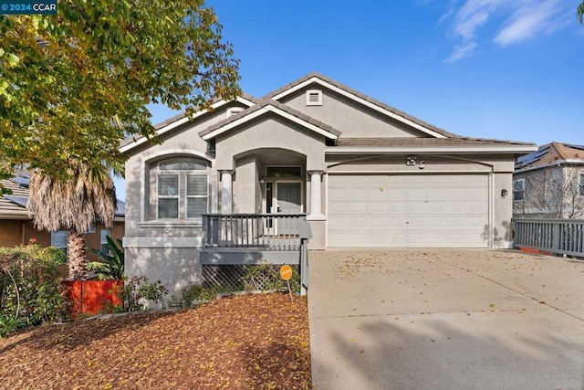 ranch-style home featuring a garage