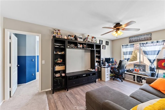 living room featuring hardwood / wood-style flooring and ceiling fan