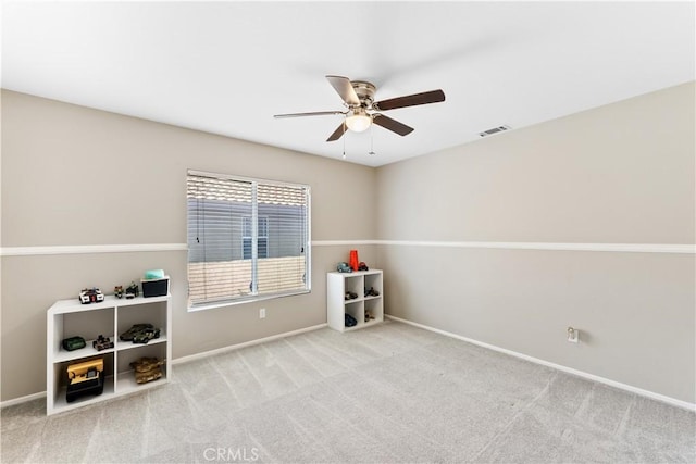 miscellaneous room featuring light carpet and ceiling fan