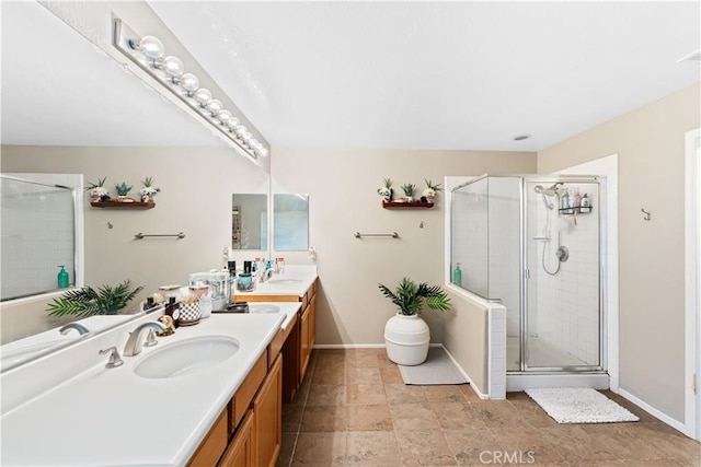 bathroom featuring vanity and a shower with shower door