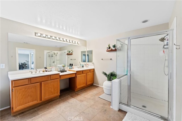 bathroom with vanity and a shower with shower door