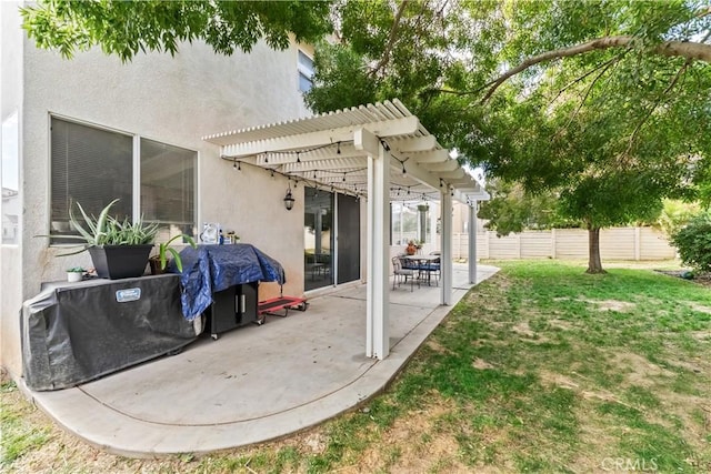 view of patio featuring a pergola and a grill