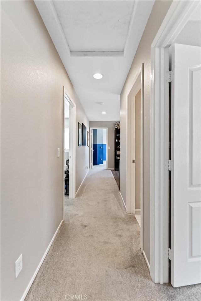 hallway with light carpet