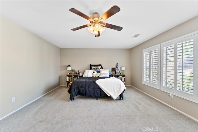 carpeted bedroom featuring ceiling fan