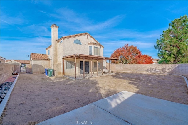 back of property with a patio area