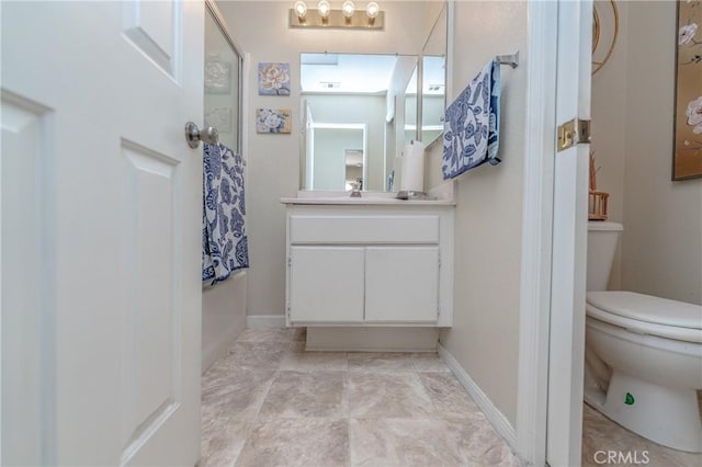 bathroom with vanity and toilet