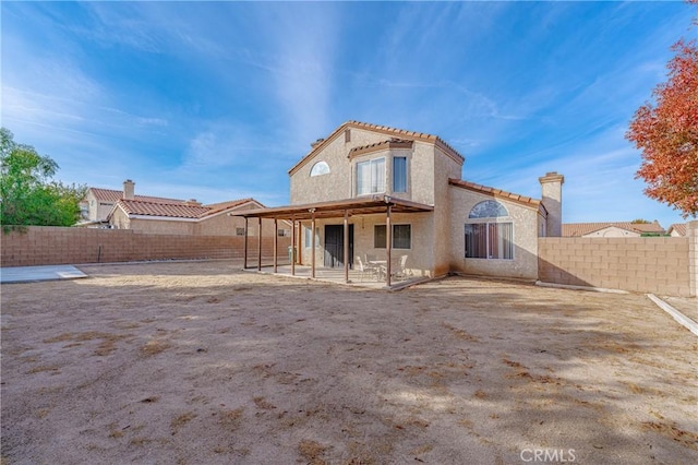 back of property featuring a patio area