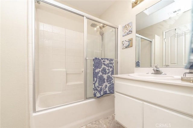 bathroom with vanity and enclosed tub / shower combo