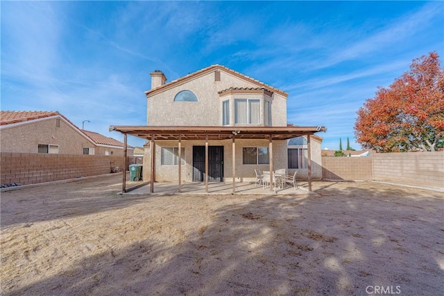 rear view of house with a patio area