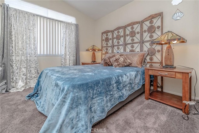 carpeted bedroom with vaulted ceiling