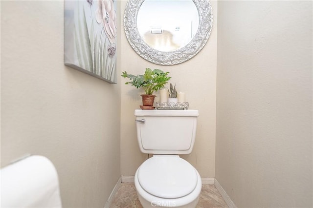 bathroom featuring tile patterned flooring and toilet