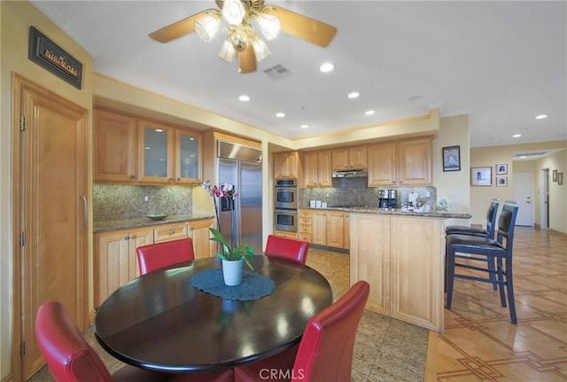 dining area featuring ceiling fan