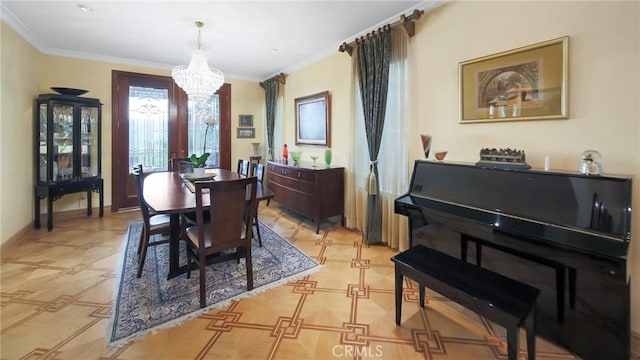 dining space with ornamental molding and a notable chandelier