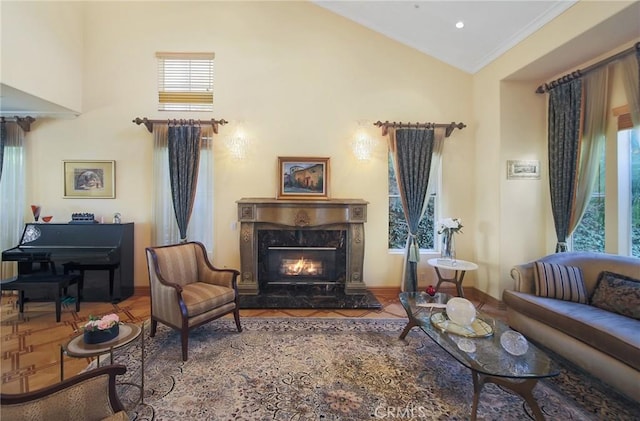 living area featuring a high end fireplace, vaulted ceiling, and ornamental molding