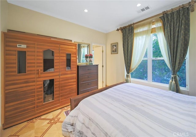 bedroom with crown molding