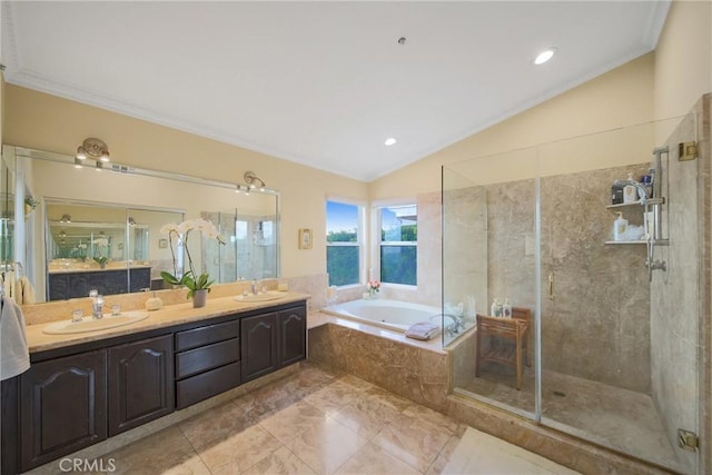 bathroom with vanity, lofted ceiling, and plus walk in shower