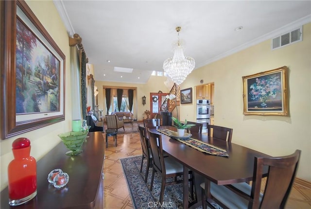 dining space with crown molding and an inviting chandelier