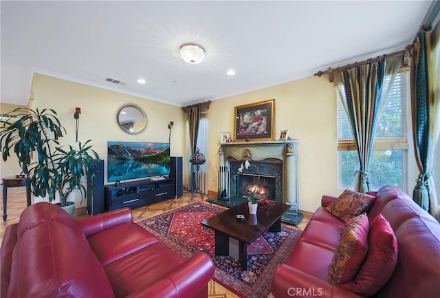 living room featuring tile patterned flooring, crown molding, and a premium fireplace