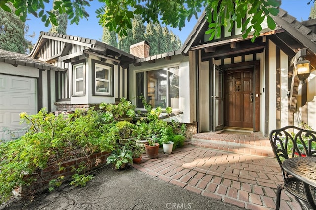 view of exterior entry featuring a garage