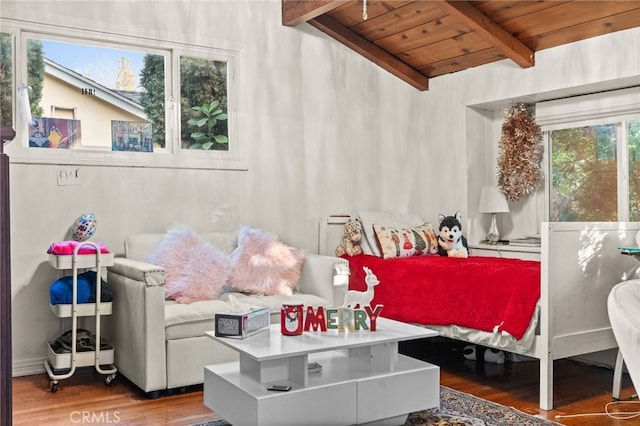 bedroom with hardwood / wood-style floors, vaulted ceiling with beams, multiple windows, and wooden ceiling